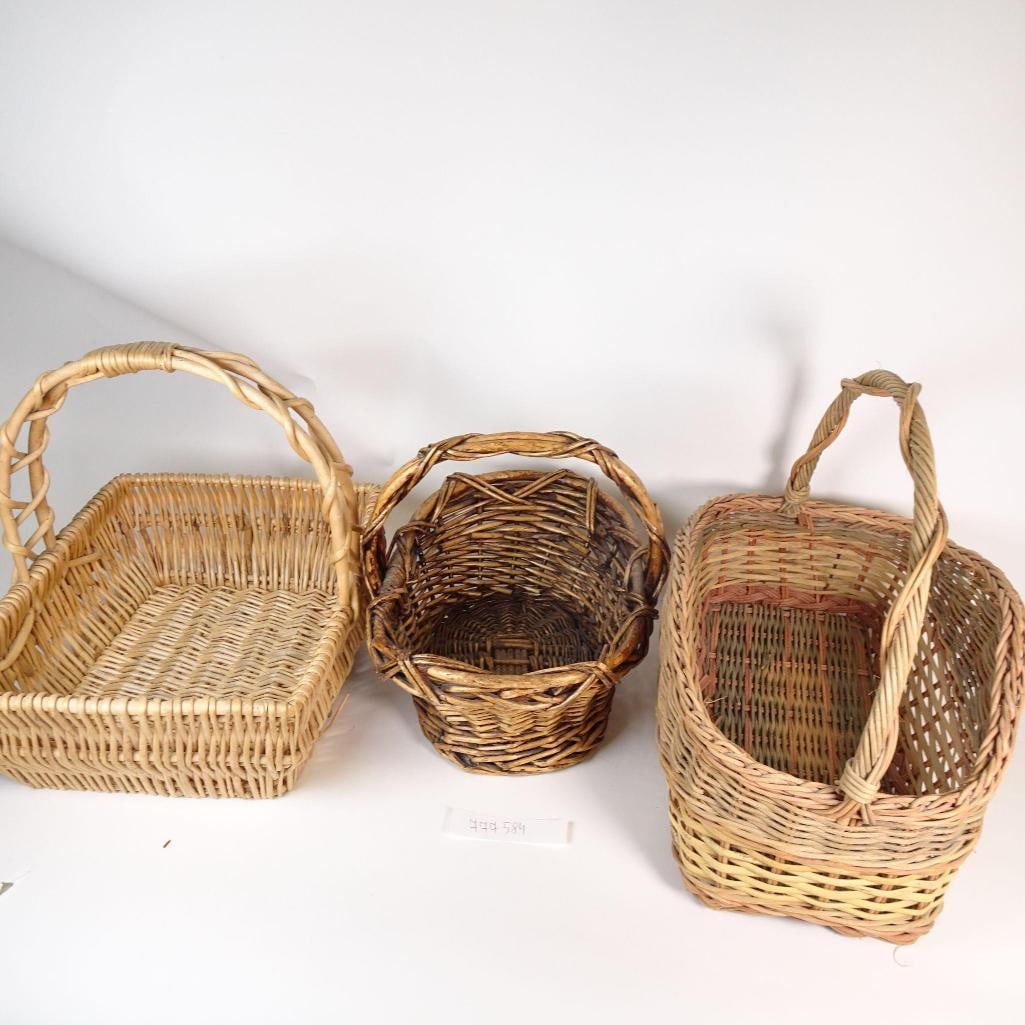 Vintage Wicker Basket Lot with Handles: This listing features a charming lot of three vintage handwoven wicker baskets, each with a sturdy handle and its own unique shape and character. These baskets are crafted from natural wicker and show