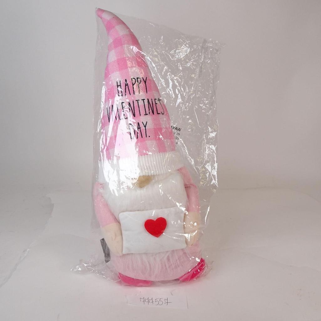 Valentine's Day Gnome Decor: Adorable Valentine's Day gnome in pink tones, holding a heart envelope. Soft plush decoration, perfect for seasonal and romantic home décor.