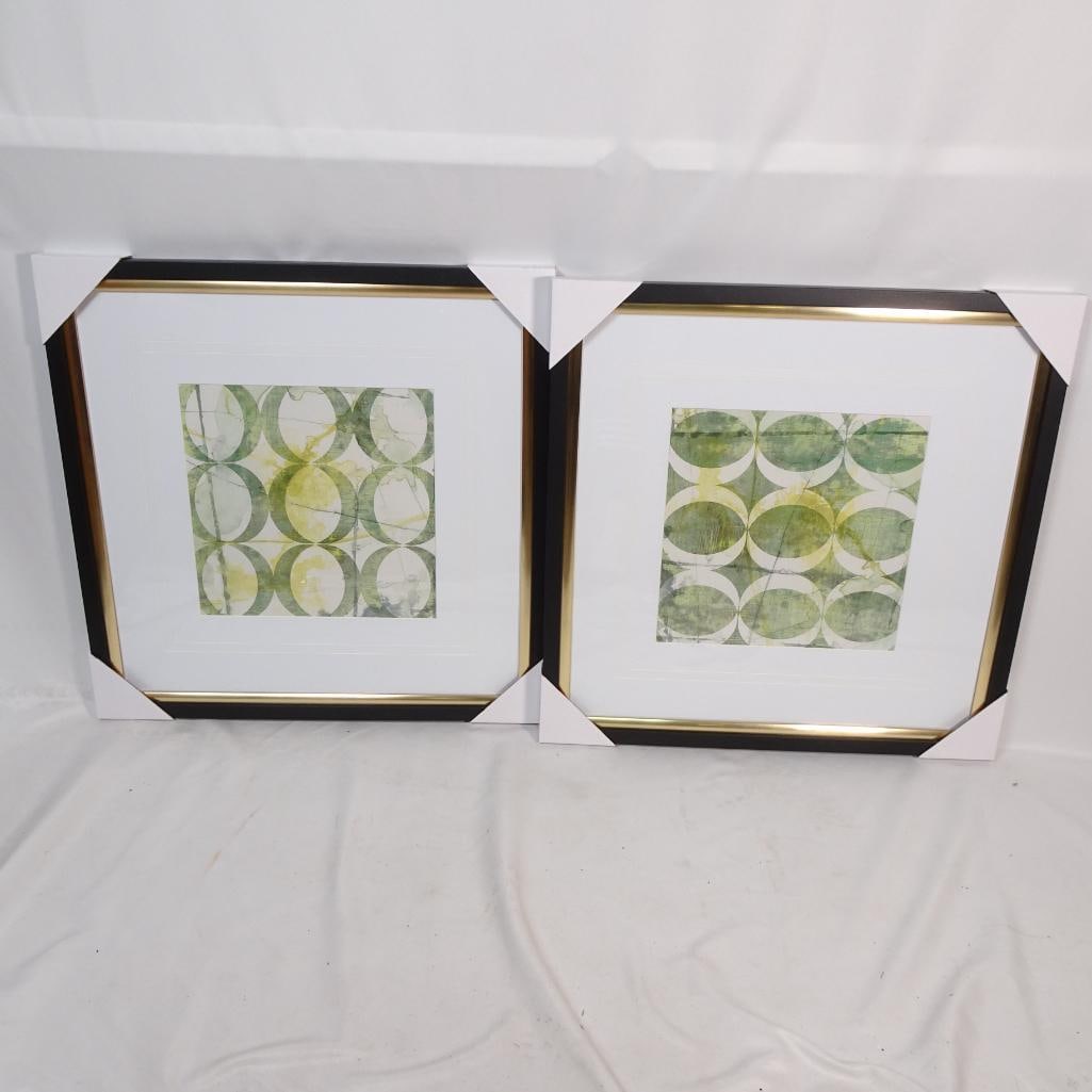 Set of 2 Framed Abstract Geometric Prints: Beautiful set of two framed abstract geometric prints featuring a modern circular pattern design in soft green, olive, and light yellow tones. The artwork is professionally framed with elegant black f