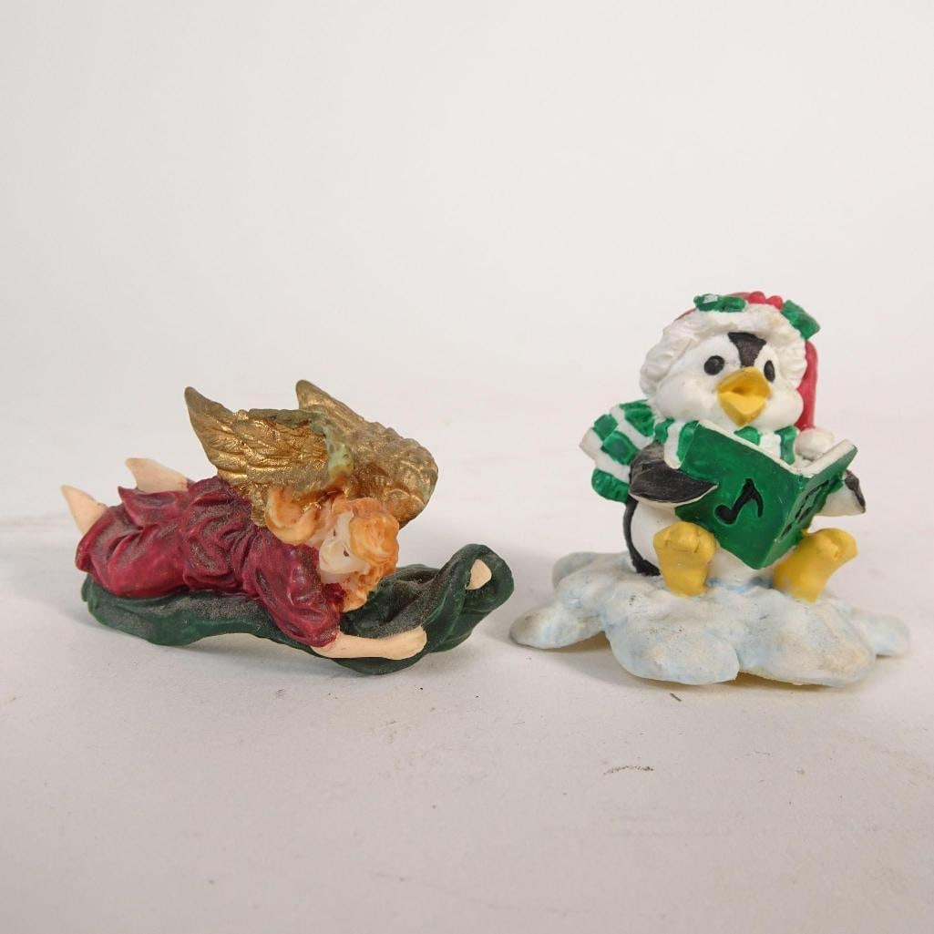 Set of 2 Mini Christmas Figurines: Set of two small vintage Christmas figurines made of resin. Condition: vintage / pre-owned, showing light age-related wear and paint patina; no visible cracks. Sold as a lot of 2 figurines.