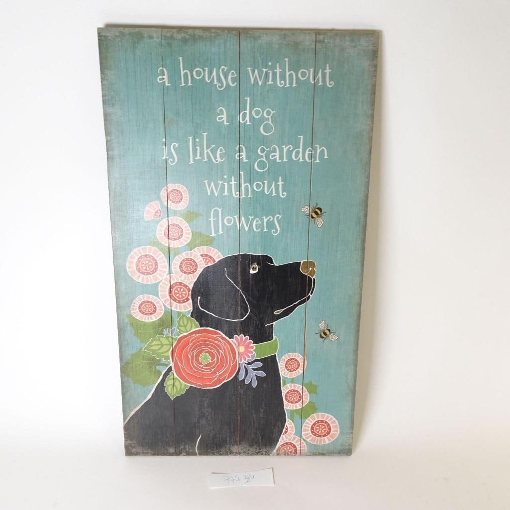 Rustic Wooden Wall Sign with Dog: Charming rustic wooden wall sign featuring a dog illustration and the quote: "A house without a dog is like a garden without flowers." Made from wooden planks with a distressed, vintage-style finish.