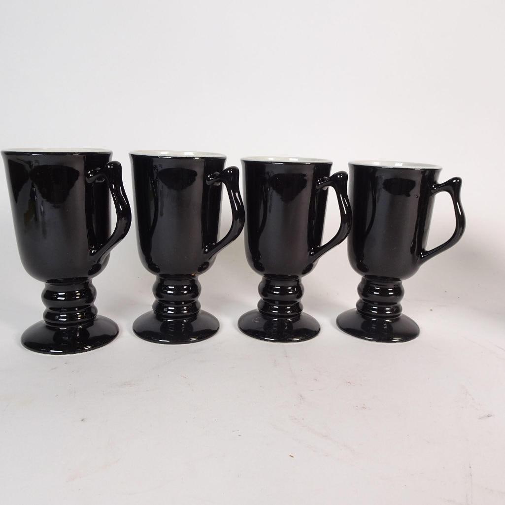 Set of 8 Hall China Black Pedestal Mugs: Elegant set of 8 vintage ceramic pedestal mugs in classic black with light interiors. Timeless goblet-style shape, perfect for coffee, tea, or hot chocolate. Each mug is marked on the base by Hall,
