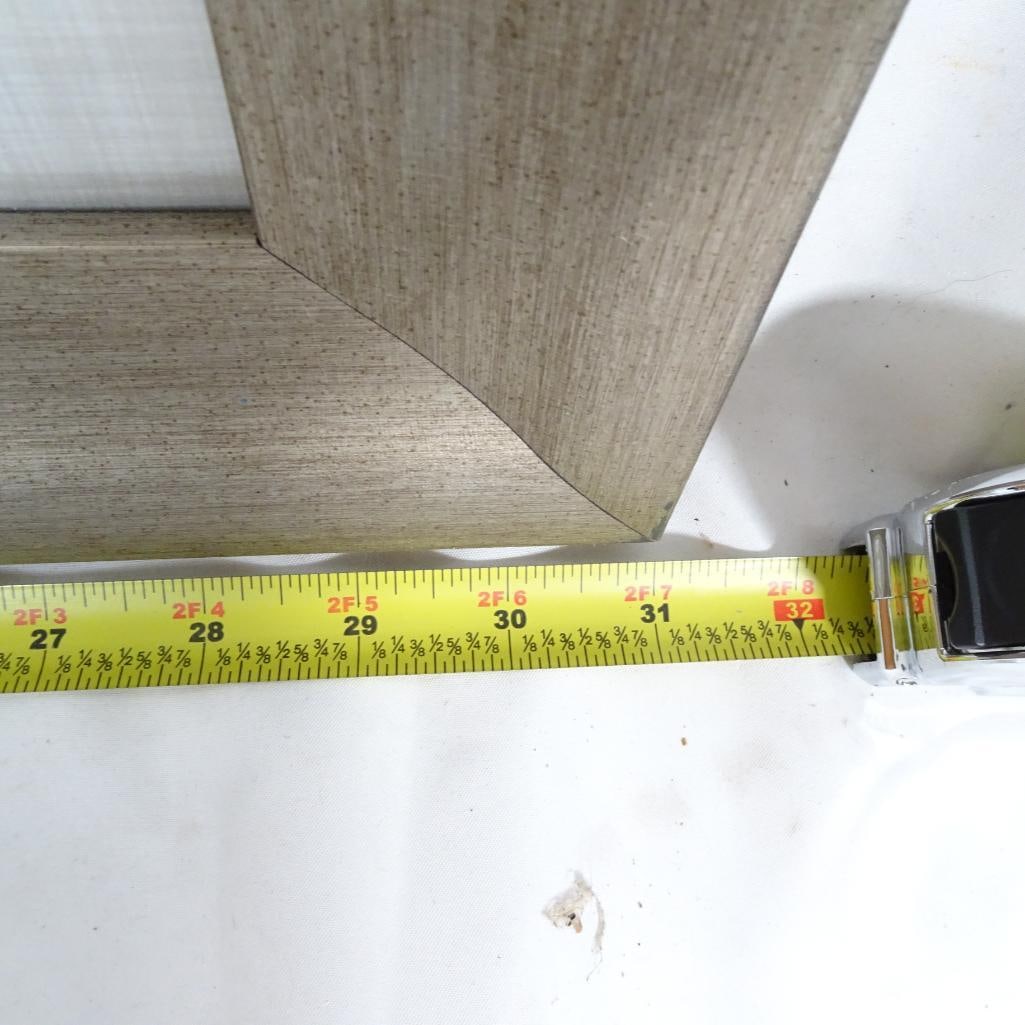 Made on Earth Magnolia Framed Wall Art: Elegant framed botanical wall art featuring a large white magnolia blossom with soft green leaves on a neutral background. This timeless floral piece blends beautifully with traditional, farmhouse,