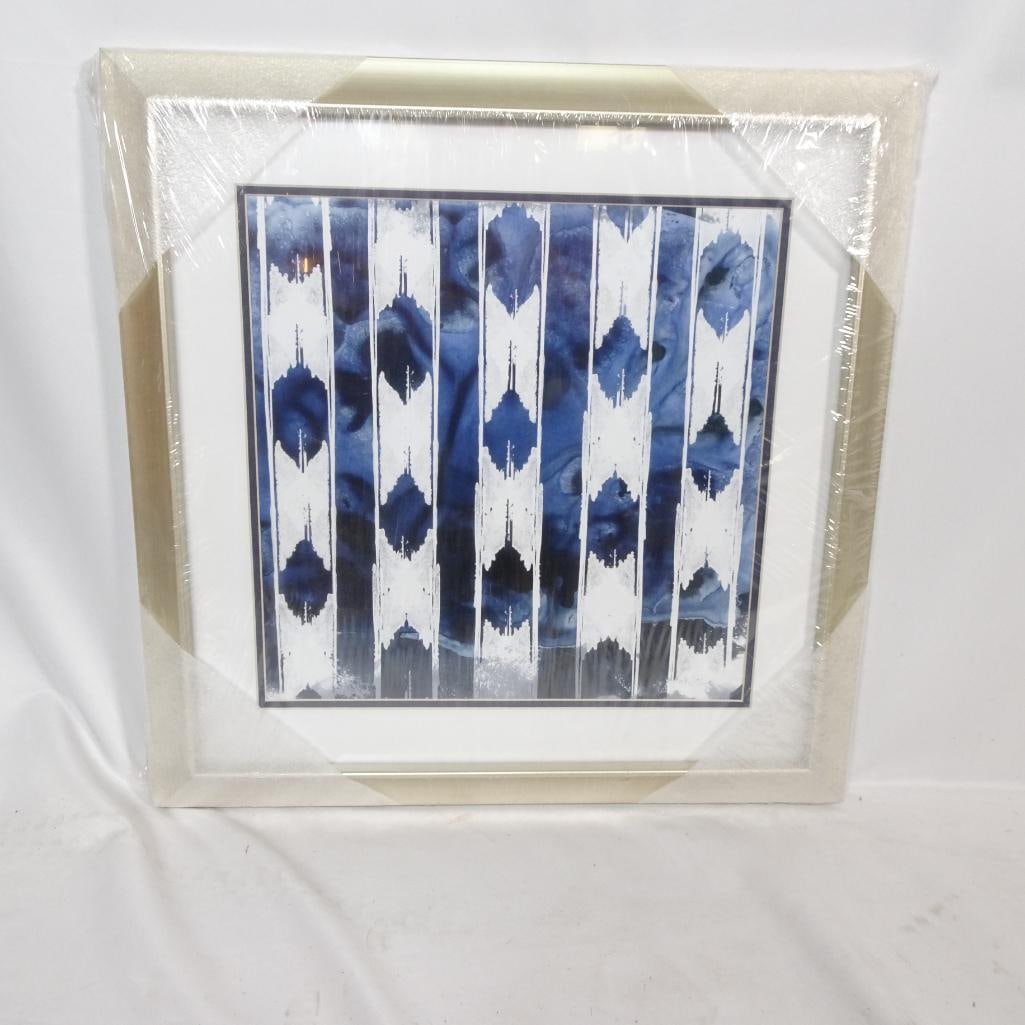 Modern Framed Blue Abstract Art Print: Elegant modern abstract art print titled ?Indigo Impression V?, featuring a rich deep blue and white pattern with a contemporary geometric design. This piece is professionally framed in a light