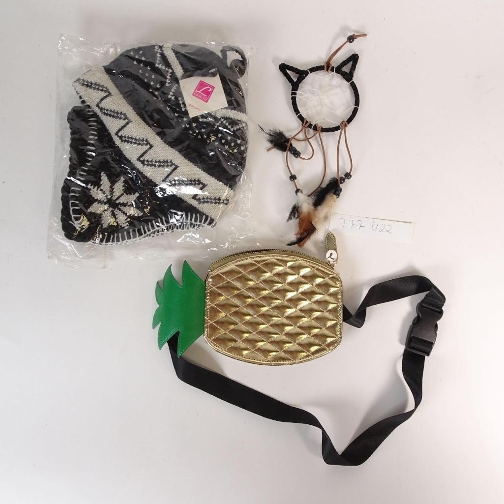 Accessories Lot: Mixed lot of fashion and lifestyle accessories sold as one auction lot. Lot includes: - gold pineapple-shaped waist bag / fanny pack with adjustable strap - black & white winter knit beanie (new, seal