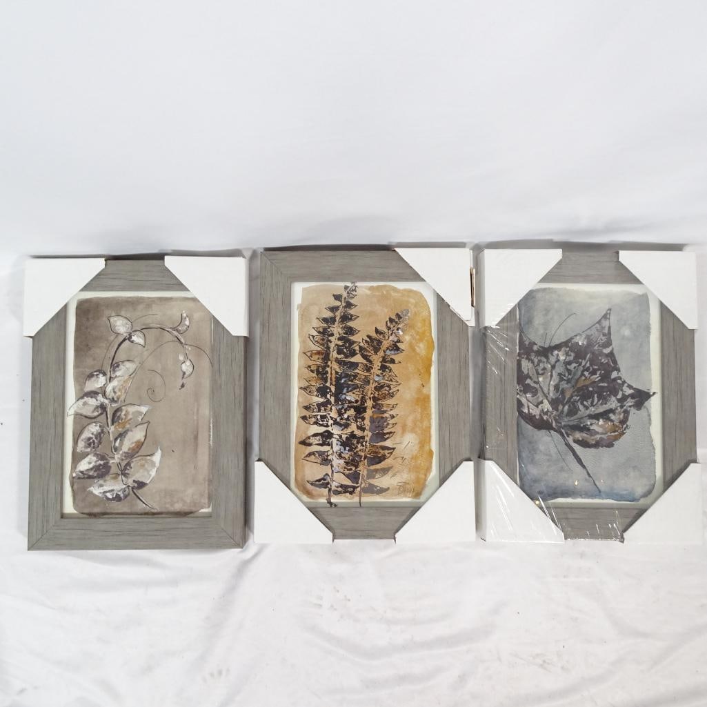 Set of 3 Botanical Leaf Framed Wall Art Prints: Beautiful set of three botanical-inspired framed wall art pieces featuring soft watercolor-style leaf and nature motifs. Each artwork is presented in a light grey wood-look frame, creating a calm neut