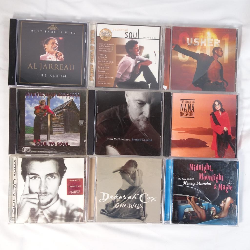 Lot of 9 Music CDs R&B Soul Pop Usher Stevie Ray Vaughan Al Jarreau + More: Mixed lot of 9 music CDs featuring a smooth blend of R&B, soul, pop, blues, and easy listening favorites. A well-balanced lot with both recognizable artists and relaxing listening styles ? perfect for