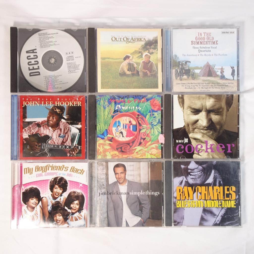 Lot of 9 Music CDs Ray Charles John Lee Hooker Joe Cocker Sting Blues Jazz + More: Mixed lot of 9 music CDs featuring a powerful mix of blues, jazz, pop, and classic hits. A fantastic mix of iconic artists and relaxing listening, perfect for collectors, resale, or everyday music lov