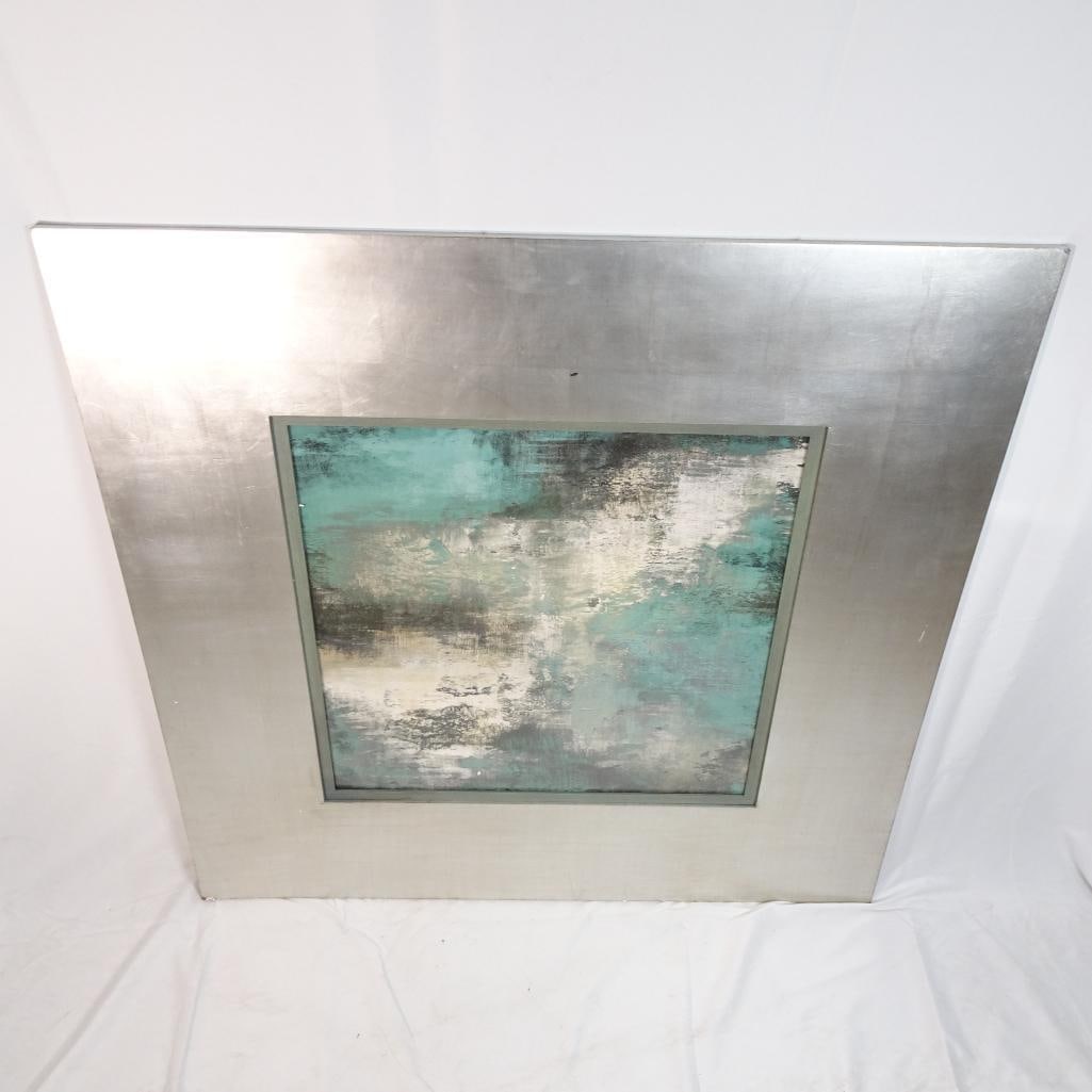 Large Modern Abstract Wall Art Framed Silver Tone Teal Gray Decor: Beautiful large modern abstract wall art featuring a soft, textured composition in teal, gray, silver, cream, and charcoal tones. The wide silver-tone frame gives it a refined upscale appearance, whil