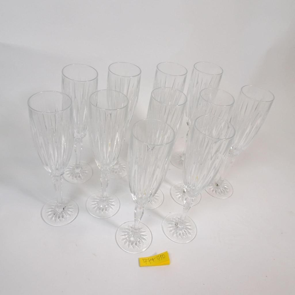 Set of 11 Elegant Cut Crystal Champagne Flutes: Elegant set of 11 tall champagne flutes made of cut crystal glass. Classic, timeless design with beautiful light reflection. Excellent condition, no chips or cracks. Perfect for celebrations, weddings