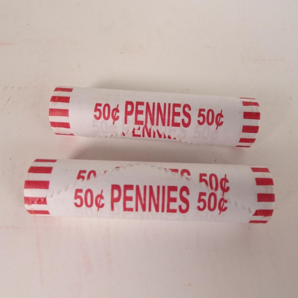 2 Bank Wrapped Penny Rolls: Lot of 2 bank-wrapped rolls of U.S. Lincoln pennies (50? each roll). Coins remain sealed in original paper wrappers as shown in photos. Great addition for coin collectors, beginners, or anyone who enj