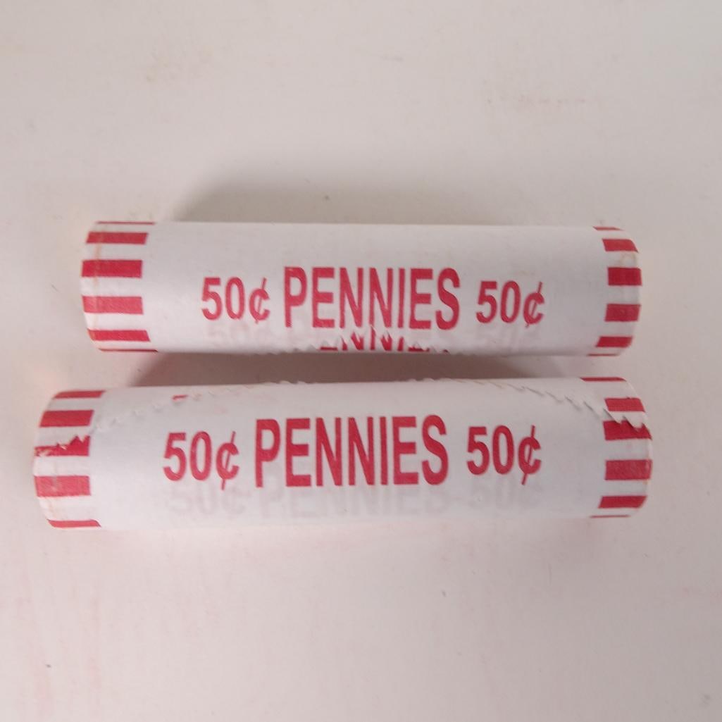 2 Bank Wrapped Penny Rolls: Lot of 2 bank-wrapped rolls of U.S. Lincoln pennies (50? each roll). Coins remain sealed in original paper wrappers as shown in photos. Great addition for coin collectors, beginners, or anyone who enj