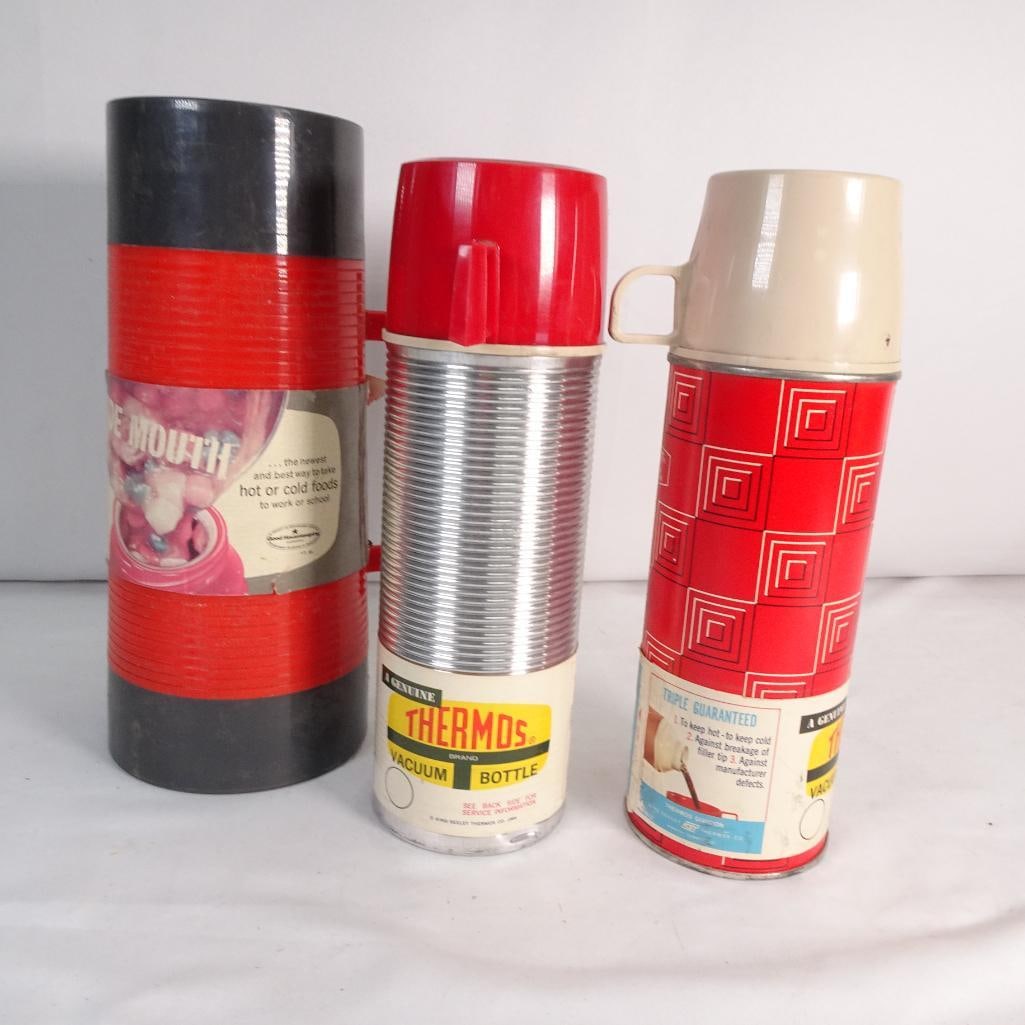 Vintage Thermos Bottles Lot of 3 NO INSERTS For Parts Repair Retro Red Camping Decor: Lot of 3 vintage thermos bottles (Thermos brand and Aladdin style). Features: Classic retro red and silver designs Includes lids, cups, and stoppers Great mid-century camping / kitchen decor look Cond