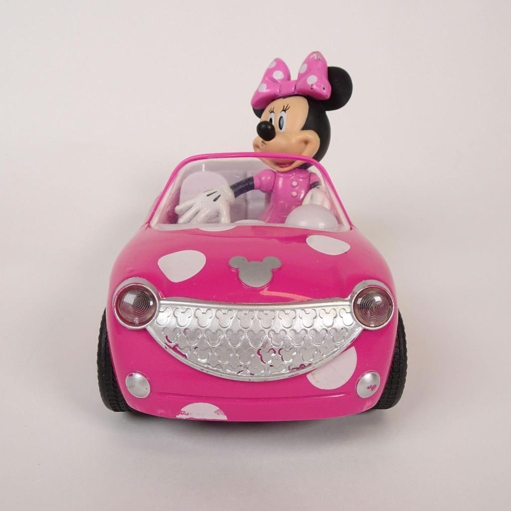 Disney Minnie Mouse Toy Lot: Mixed Disney Minnie Mouse toy lot, perfect for kids, Disney fans, or collectors.Includes:-Minnie Mouse plush doll-Pink Minnie car with figure-Minnie Mouse toy camera-Minnie plastic container-Minnie ke
