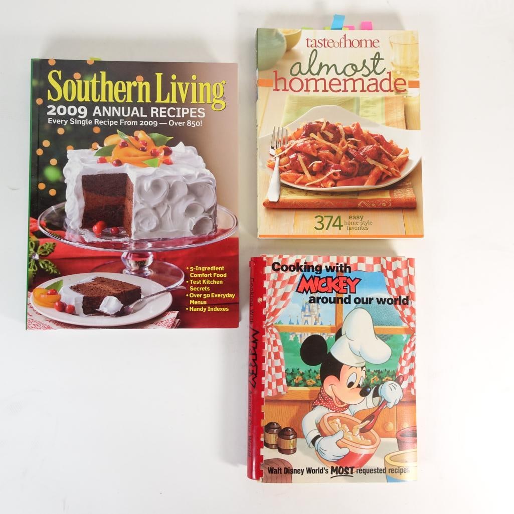 Vintage Cookbook Lot of 3: Set of three vintage and modern collectible cookbooks featuring a variety of home-style recipes, classic comfort food, and Disney-themed favorites. Condition: Pre-owned vintage condition with normal s
