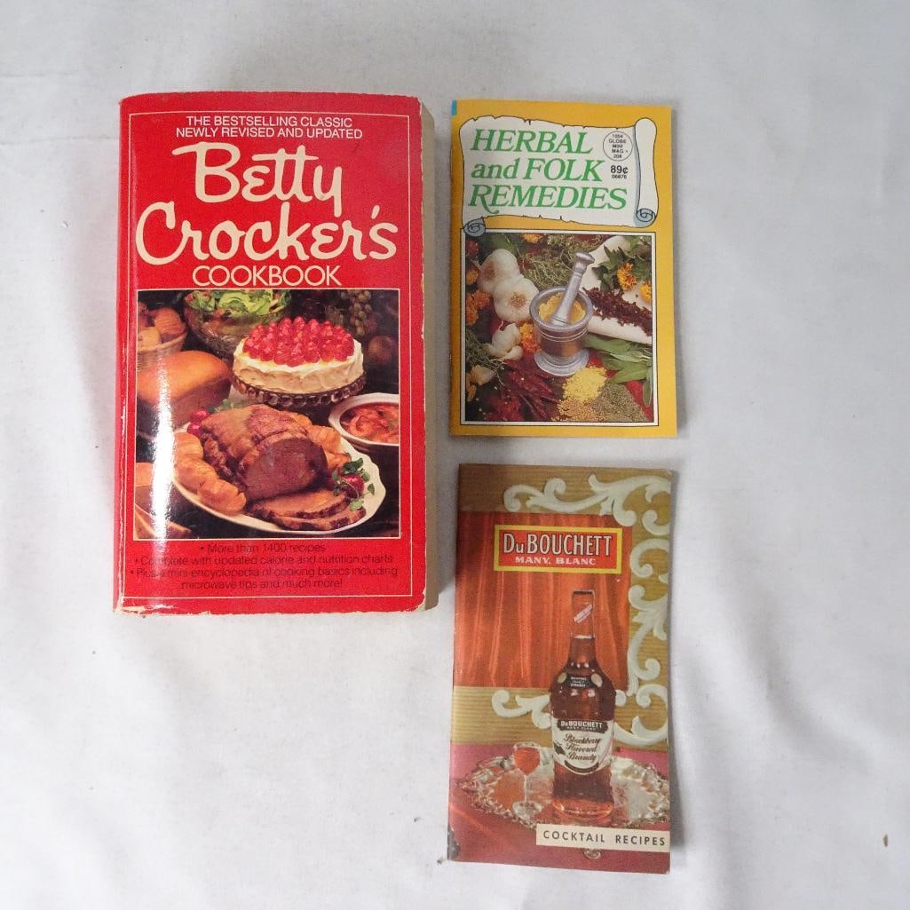 Vintage Cookbook & Recipe Booklet Lot: A fun mixed collection for cookbook collectors, vintage kitchen dcor lovers, retro recipe enthusiasts, or display styling. Includes classic home cooking recipes, folk remedy references, and vintage