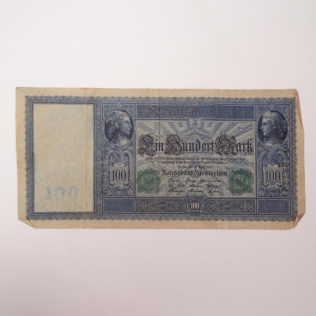 Germany - 100 Mark - 1910:: This 1910 100 Mark banknote from Germany is a beautiful example of pre- World War I currency, issued by the Reichsbank. It features intricate designs and ornate patterns representing commerce, reflect