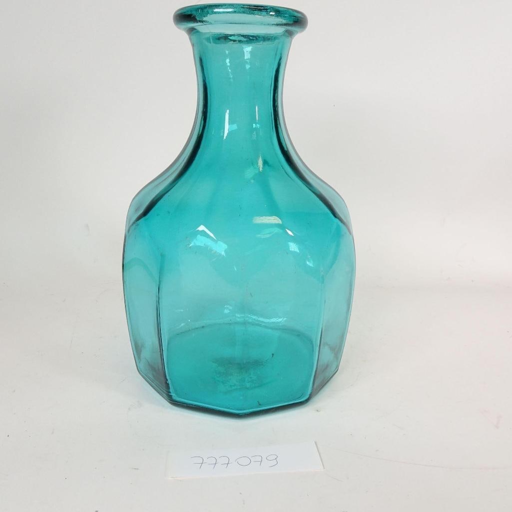 Vintage Turquoise Glass Vase: Beautiful vintage-style glass vase in a striking turquoise/aqua color.The vase features a classic tall silhouette with a gently flared neck and faceted lower body, giving it an elegant yet timeless lo