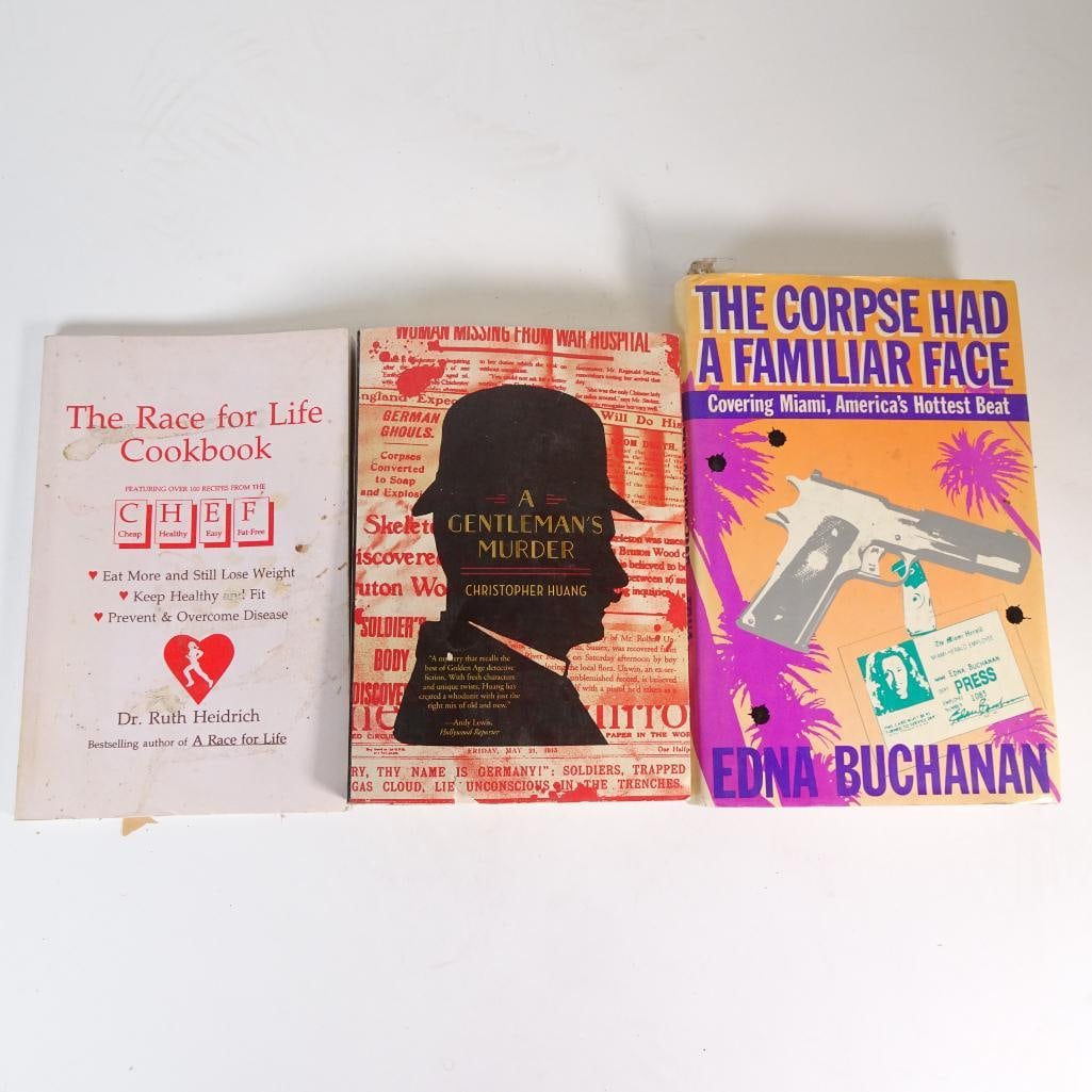 Vintage and Modern Book Lot: Mixed book lot featuring three titles in various genres including cookbook, mystery, and crime fiction. Condition: Pre-owned vintage/used condition. Covers may show marks, discoloration, or shelf wear