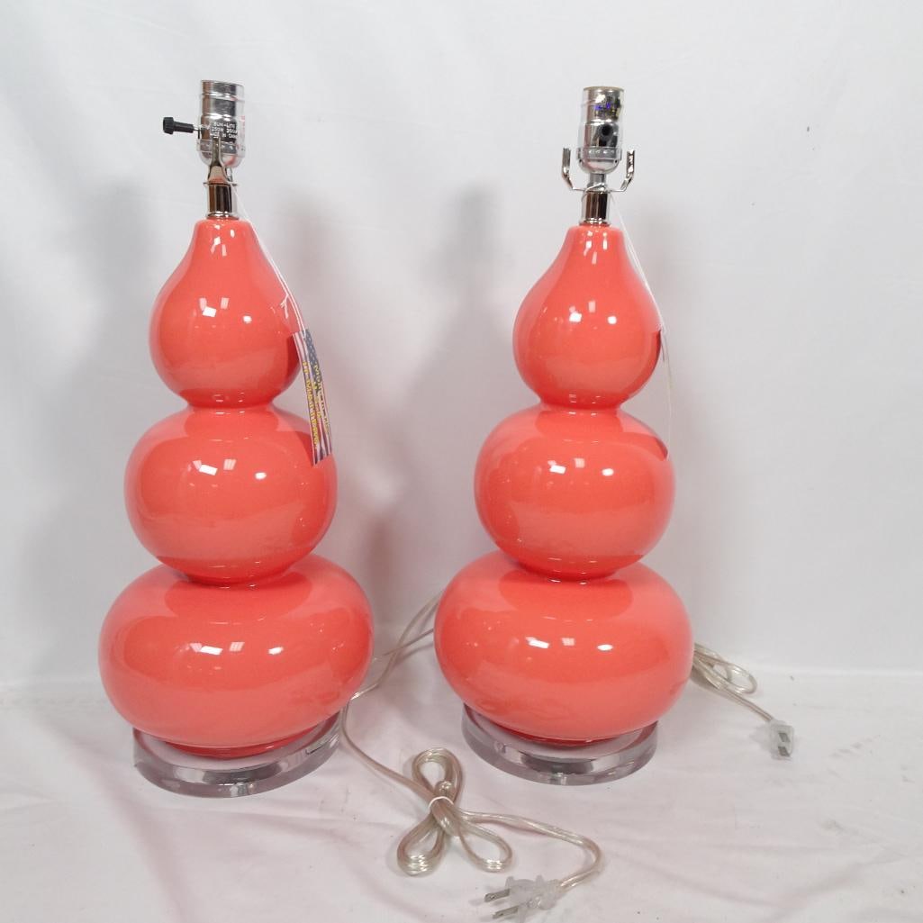 New Pair Coral Pink Glass Table Lamps: Brand new pair of coral pink glass table lamps featuring a sculptural stacked bubble silhouette and clear acrylic pedestal bases. The glossy vibrant finish makes these a true statement piece ? perfect