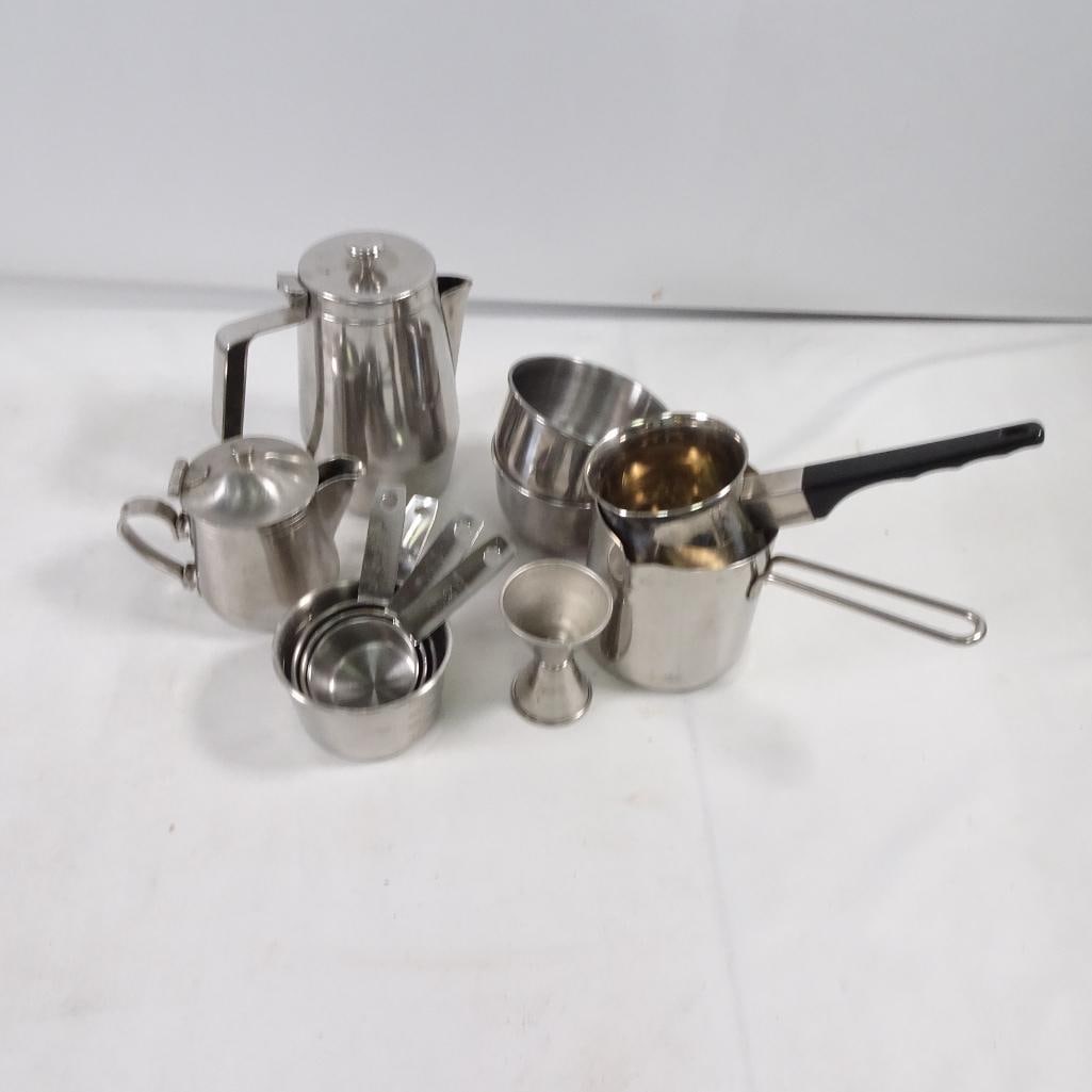 Stainless Steel Kitchen Lot Coffee Pot Creamer Measuring Cups Sauce Pan Bar Jigger Set: Mixed lot of stainless steel kitchen and barware items. Condition: Pre-owned condition Visible signs of use (scratches, discoloration, patina inside some pieces) No major damage noted Perfect for: Eve