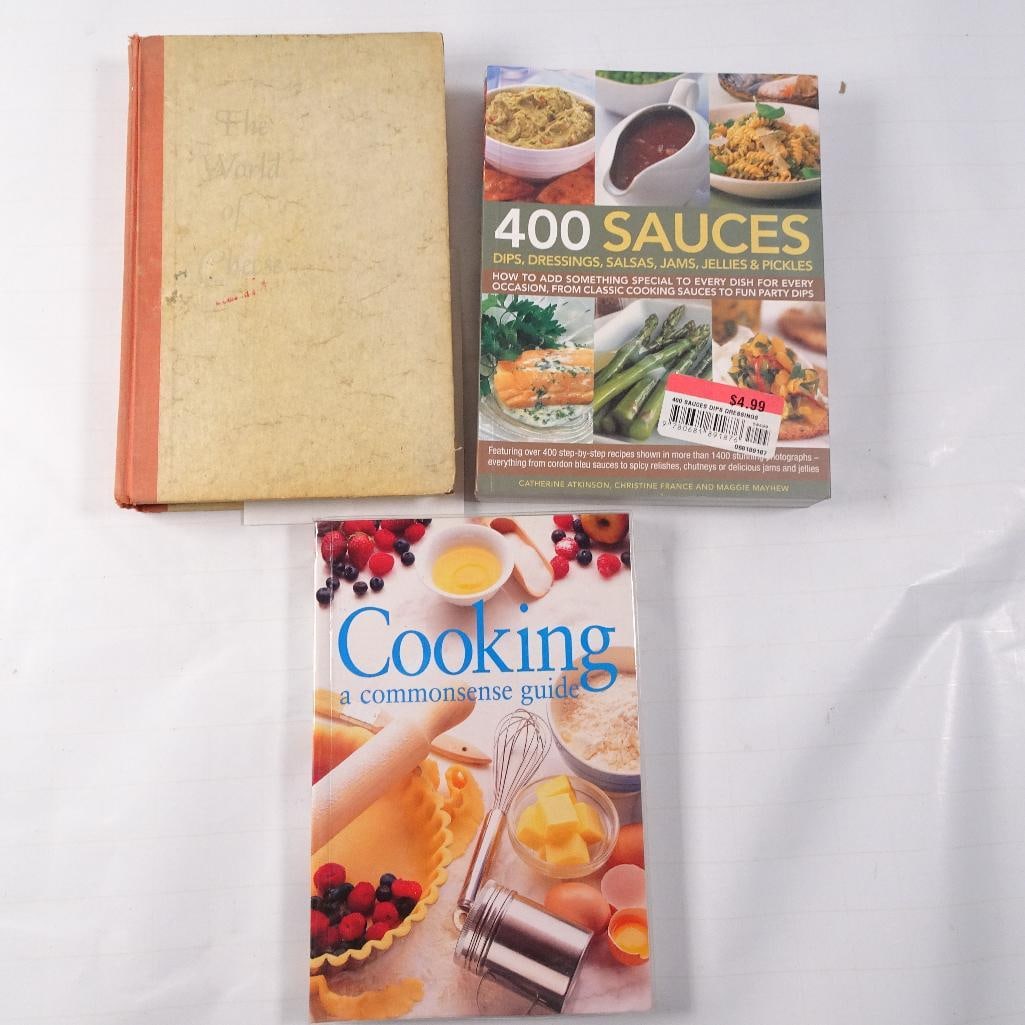 Lot of 3 Vintage and Modern Cookbooks: A nice mixed collection of cookbooks covering cheese, sauces, and everyday cooking fundamentals. This lot includes a collectible first edition cheese reference along with two modern recipe and techniq