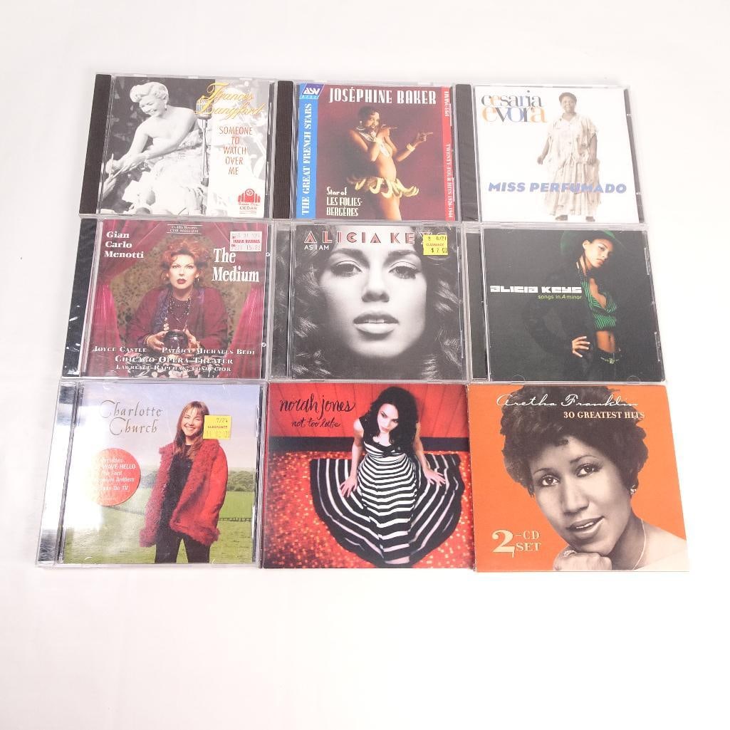 Lot of 9 CDs: Pre-owned lot of 9 music CDs featuring a mix of soul, jazz, pop, world music, opera, and vocal classics. Sold as one lot.