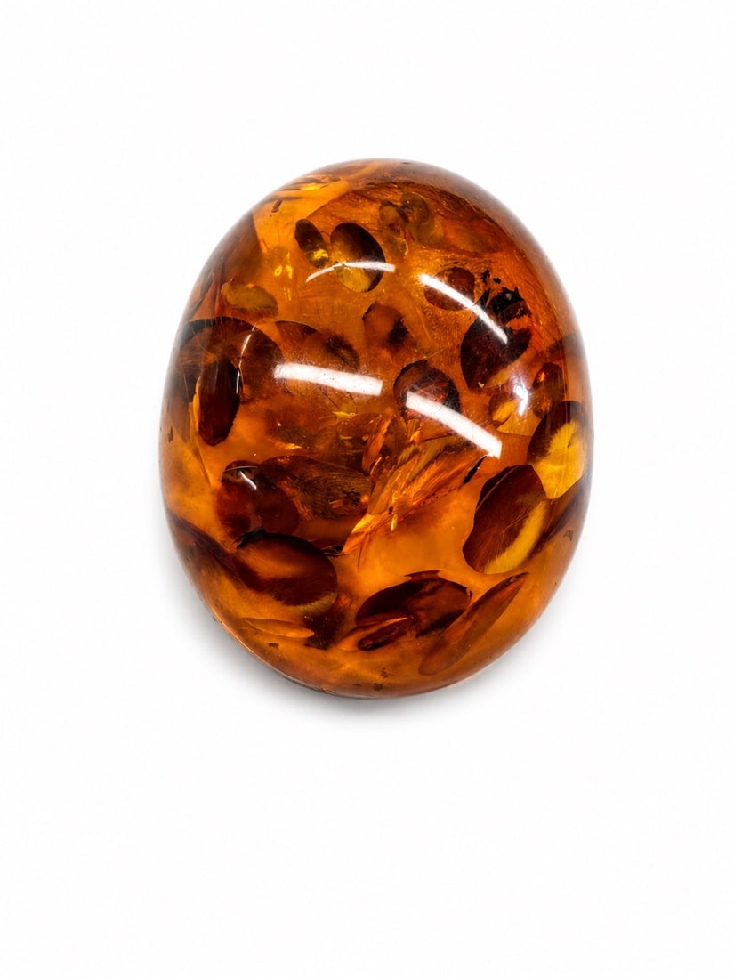 Raw Amber stone collection with one amber pendant: 4 unqiue amber pieces oval - 14.78 g diamond shape 4.21g, triangle 16.g, pendant 17.83g has a lots of inclusions including insects and leaves maybe a flower