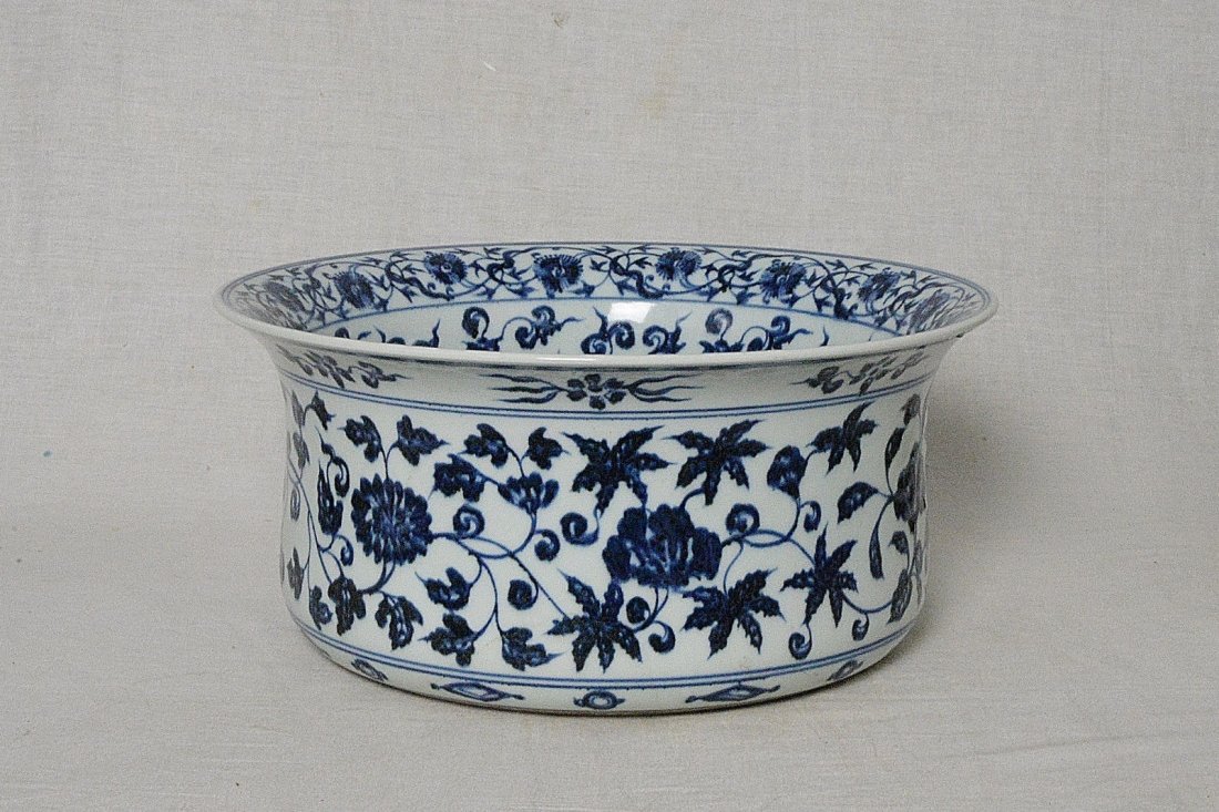 Chinese Blue and White Porcelain Pot: Chinese blue and white porcelain flower pot, decorated with flowers. Good condition. 12.6" diam x 6" height.