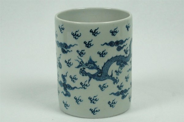 Chinese Blue and White Porcelain Pen Holder: Chinese blue and white porcelain pen holder, decorated with phoenix and floral. 5" x 4".