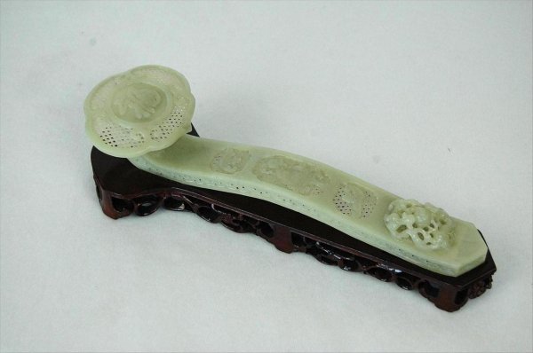 Chinese Large Jade Ruyi-Scepter: Chinese jade ruyi-scepter, mid-20th century, well carved and pierced with a long curving shaft with three central reserves of a fish flanked by bats on lattice ground, the end with a high-relief carvi