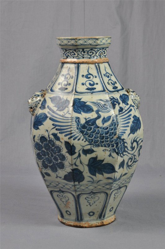 Chinese blue-and-white hexagonal porcelain vase: Chinese blue-and-white hexagonal porcelain vase, the facetted body painted in shades of cobalt blue with a wide band of phoenix amid flowering peony sprays, all bracketed by large jeweled lappets enci