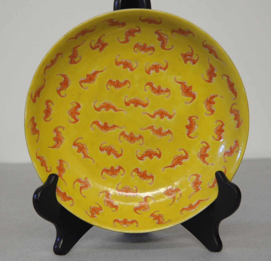 Chinese Famille Rose Porcelain Plate: Chinese yellow base famille rose porcelain plate , decorated with bats and flowers. Six red character mark on the base. 8" diam.
