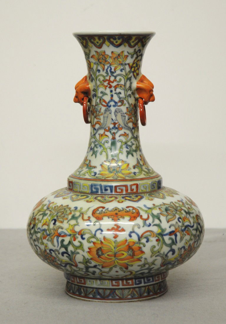 Chinese Dou-Cai Porcelain Flat Vase: Chinese dou-cai porcelain flat vase, decorated with floral around the vase.Two animal heads and ring as decoration on the side. Six blue character under glaze mark on the base.