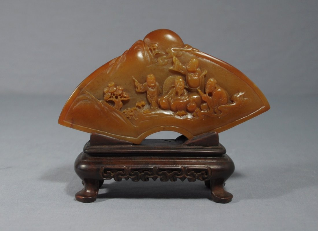 Nice Carved Chinese Shou-Shan Stone Table O: Nice carved fan shape Chinese shou-shan stone table ornament, decorated with figures. Early 20th century. Good condition. 6" wide x 4.9" height with wood stand.