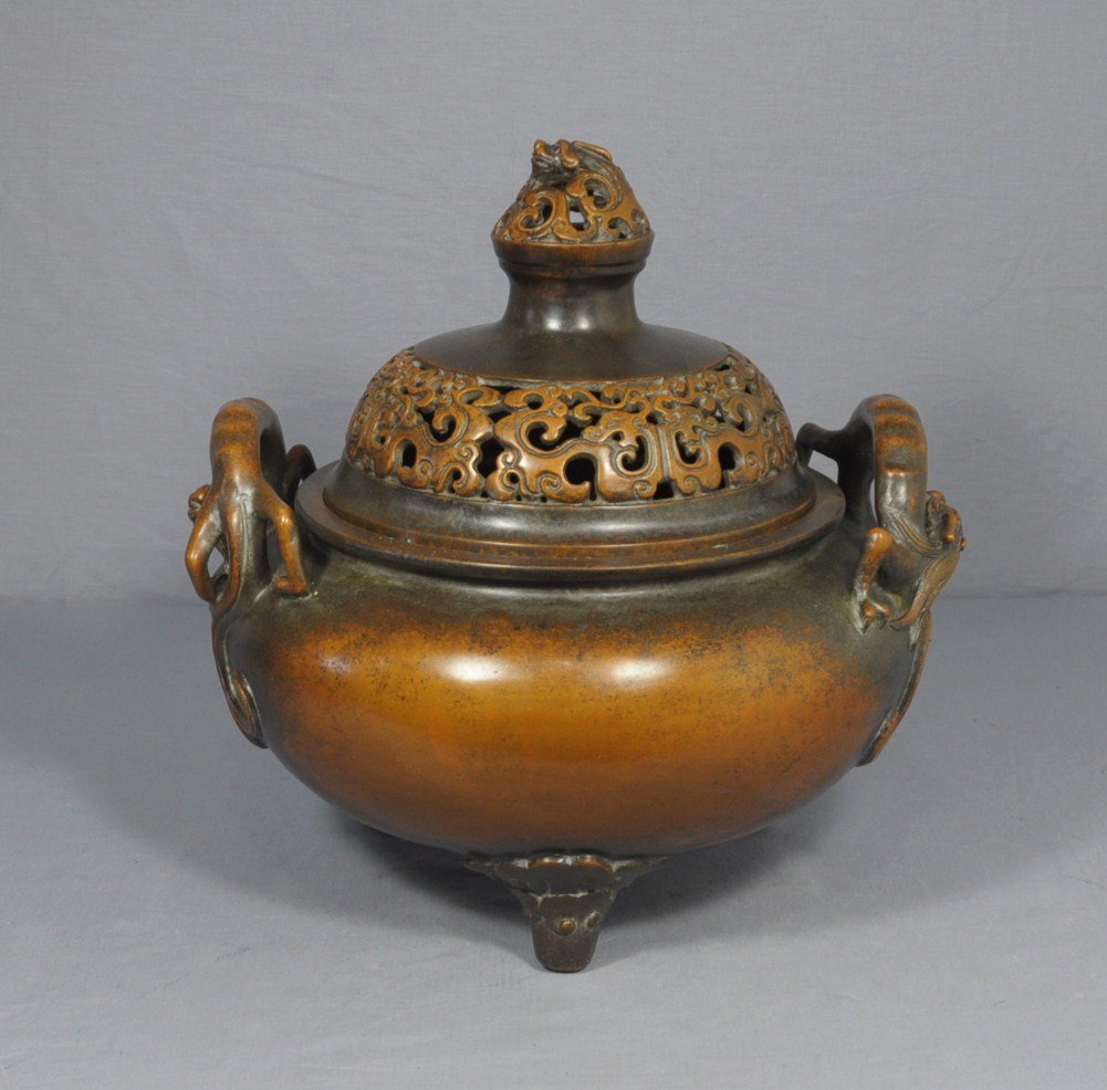 Large Chinese Bronze Censer with Mark: Large Chinese tripod bronze censer with mark, decorated with dragons as handle. 19th century. Good condition. 12" diam x 13" height.
