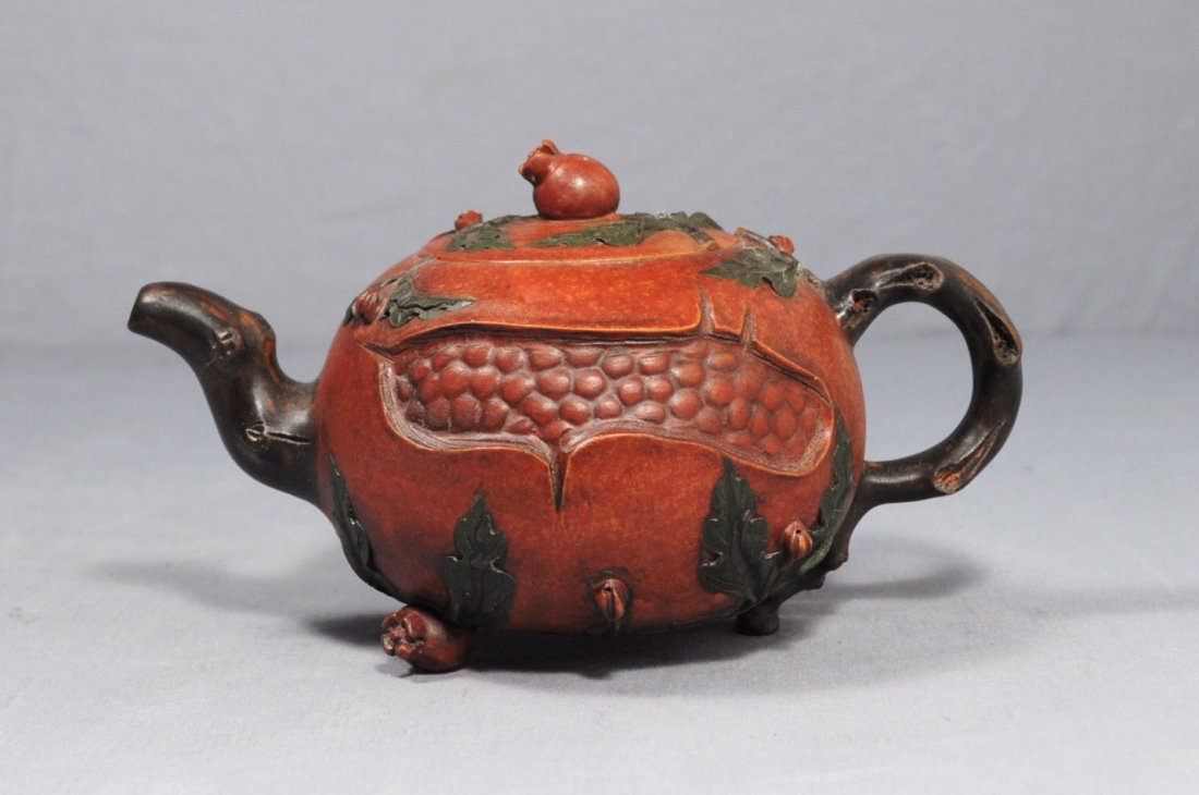 Chinese Ceramic Teapot with mark: Chinese ceramic teapot with mark, decorated as pomegranate. Early 20th century. 7.75" wide x 4" height.