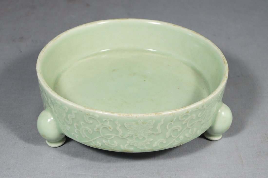 Chinese Celadon Tripod Porcelain Brush Washe: Chinese celadon tripod porcelain brush washer, decorated with flowers. 19th century. Good condition. 8" diam x 2.75" height.