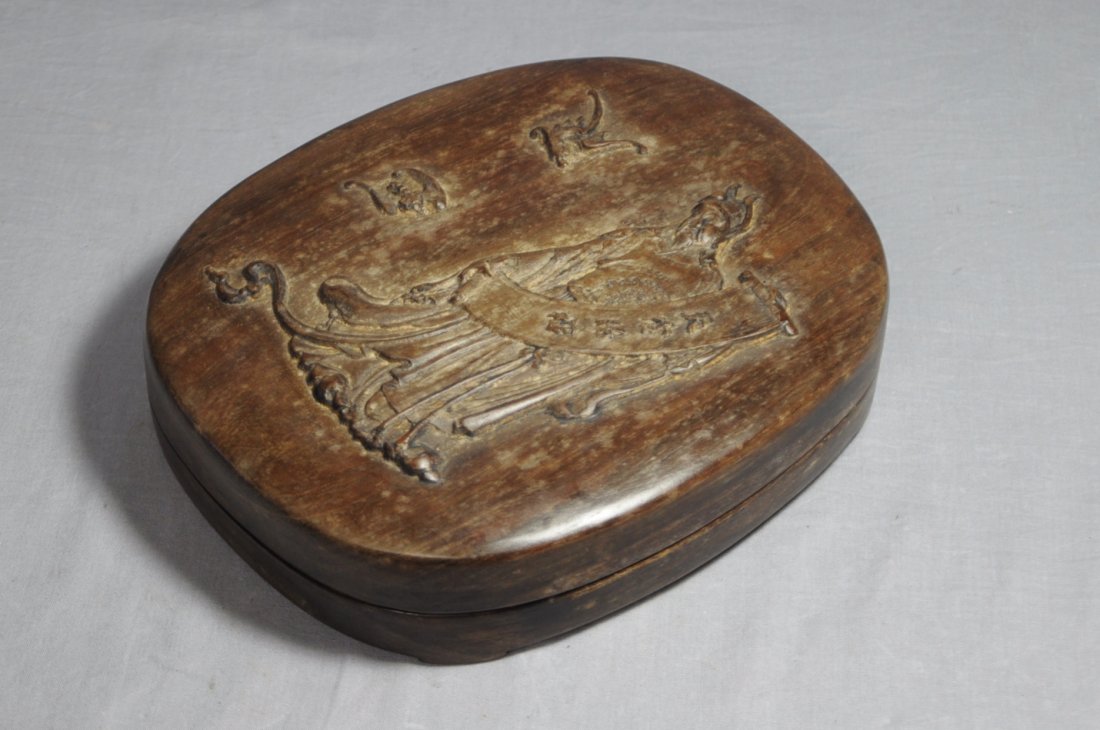 Chinese Ink Stone With Carved Wood Box: Chinese ink stone with carved wood box, decoratwd with figure and bats. Early 20th century. 7.1" x 5.75".