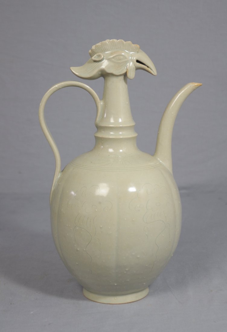 Chinese Celadon Glaze Porcelain Water Bottle: Chinese celadon glaze porcelain water bottle with handle, decorated with chicken head on the top. Good condition. 11.5" height.