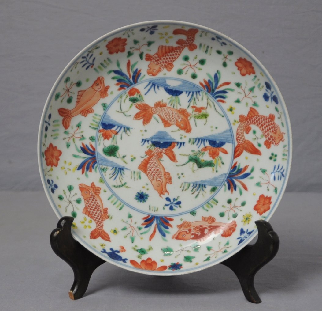 Chinese Dou-Cai Porcelain Plate: Chinese dou-cai porcelain plate, decorated with fishes and flowers. Six blue Chinese character under glaze mark on the base. 8.25" diam.