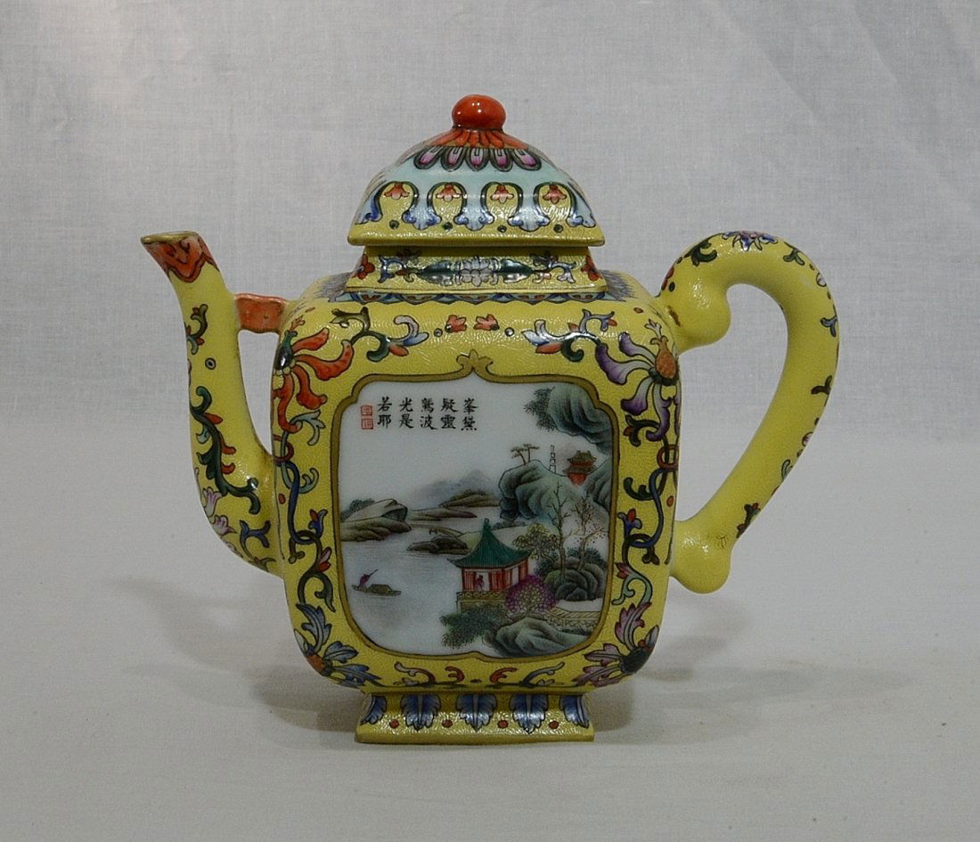 Chinese Famille Rose Porcelain Teapot With Mark: Chinese yellow base famille rose porcelain teapot, decorated with landscape and mountain view around by flowers. Four blue character mark on the base. Good condition. 7" wide x 6.25" height.