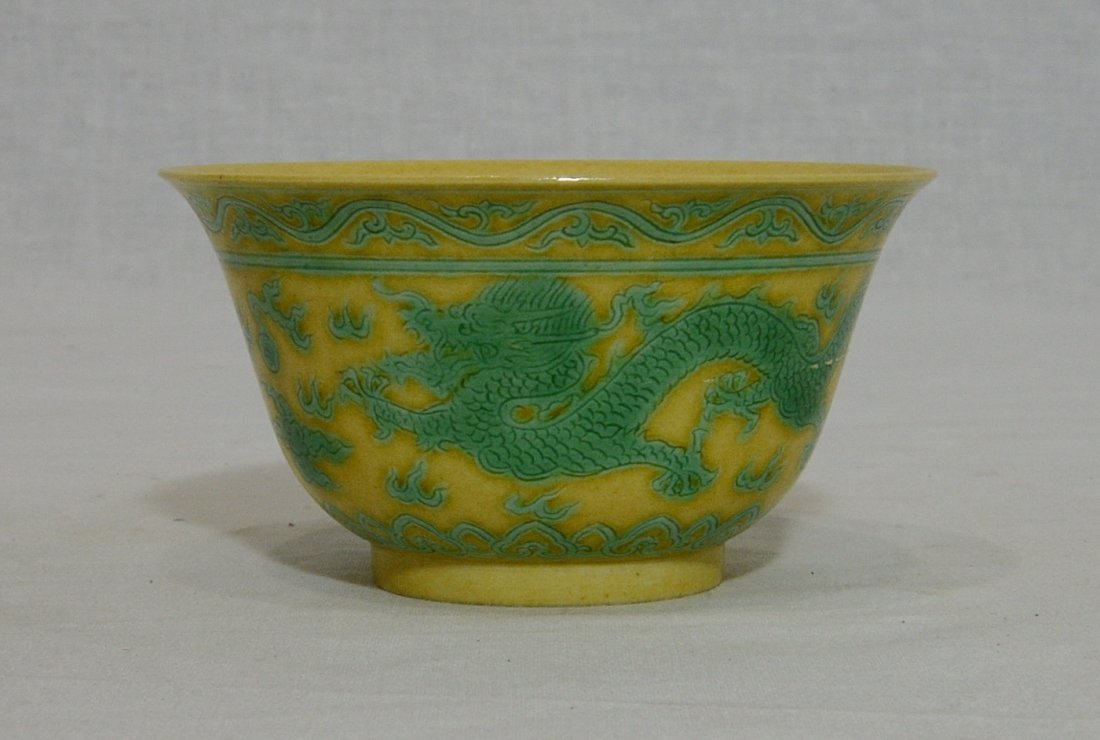Chinese Yellow Glaze Porcelain Cup With Mark: Chinese yellow glaze porcelain cup, decorated with green glaze dragons. Six blue character under glaze mark on the base. Good condition. 4" diam x 2.1" height.