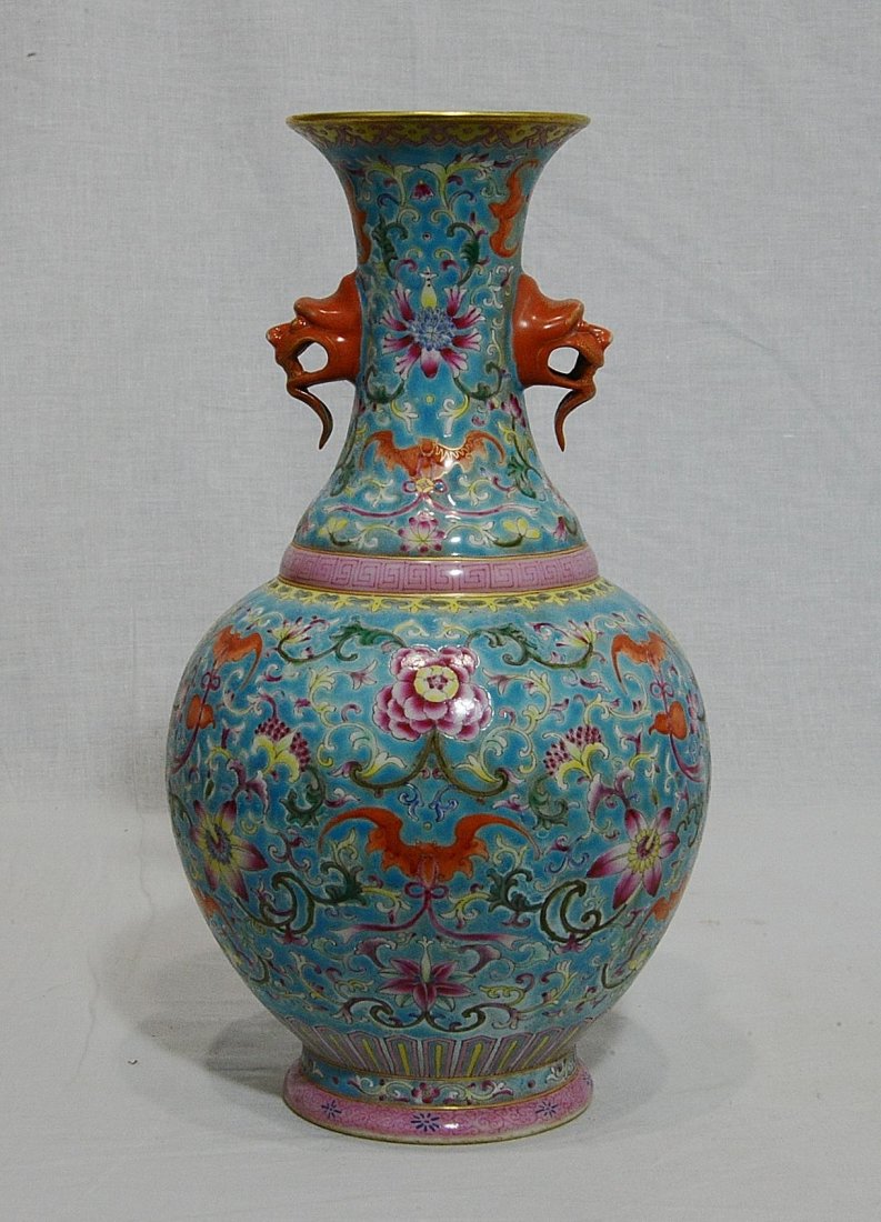 Chinese Famille Rose Porcelain Vase With Mark: Chinese famille rose porcelain vase, decorated with flowers and bats. Two animal heads as decoration on the side. Six red character mark on the base. Good condition. 12.5" height.
