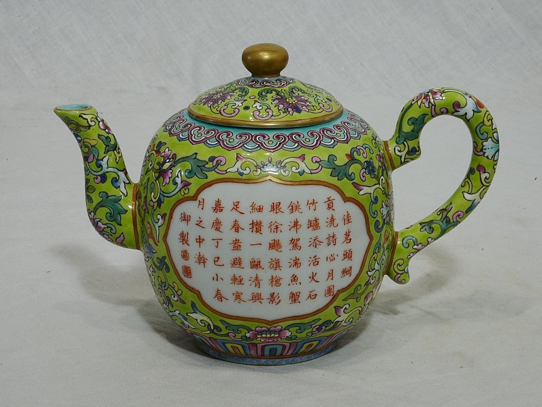 Chinese Famille Rose Porcelain Teapot With Mark: Chinese famille rose porcelain teapot, decorated with open window of Chinese calligraphy around by flowers. Six red character mark on the base. Good condition. 7" wide x 5" height.
