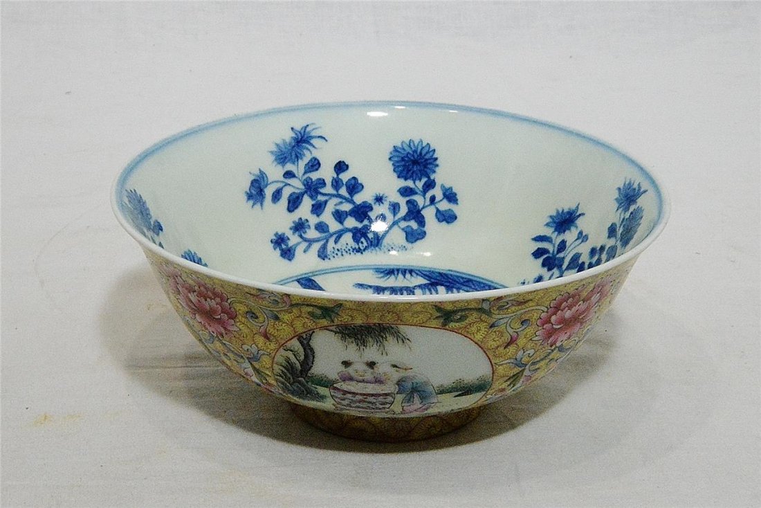 Chinese Famille Rose Porcelain Bowl With Mark: Chinese famille rose porcelain bowl, decorated with blue and white landscape interior. Four round window of kids and landscape view around the by flowers. Six blue Chinese character under glaze mark o