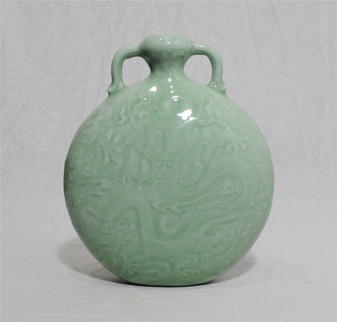 Chinese Monochrome Green Glaze Porcelain Moon Flat Vase: Chinese monochrome green glaze porcelain moon flat vase, decorated with dragons. Six blue Chinese character under glaze mark on the base. Good condition. 8.25" height.