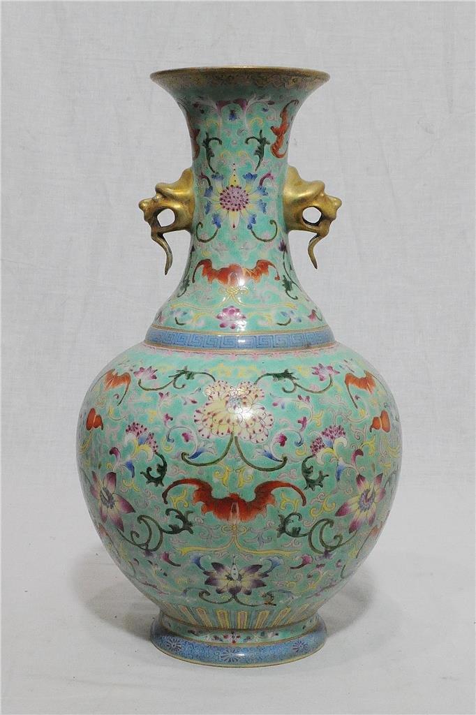 Chinese Famille Rose Porcelain Vase With Mark: Chinese famille rose porcelain vase, decorated with flowers and gilt dragon heads on the side. Six red Chinese character mark on the base. Good condition. 12.25" height.