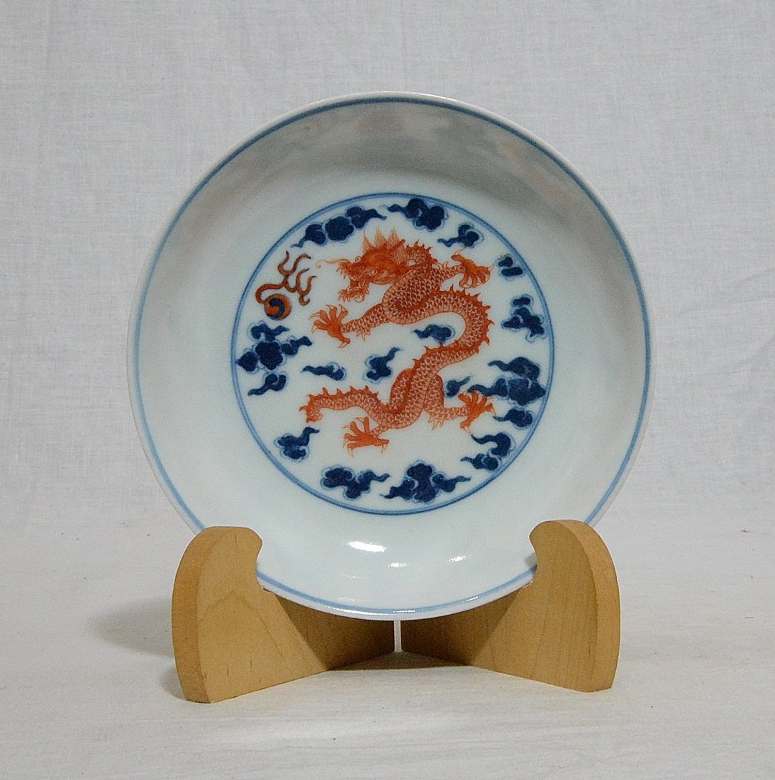 Chinese Blue and White Porcelain Plate With Mark: Chinese blue and white porcelain plate, decorated with red dragons. Six blue Chinese character under glaze mark on the base. Good condition. 6.5" diam.