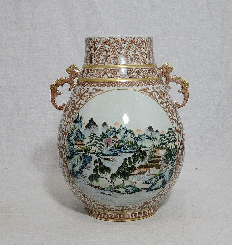 Chinese Famille Rose Porcelain Vase With Mark: Chinese famille rose porcelain vase, decorated with open window of landscape and mountain view. Six red Chinese character mark on the base. Good condition. 12" height.